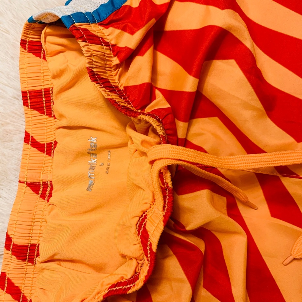 Marika orange shorts.